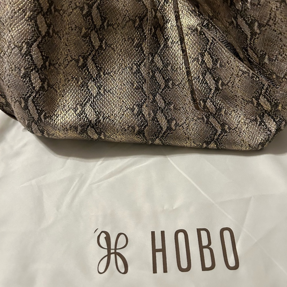 Practically brand new hobo bag, with dust bag. Snake skin